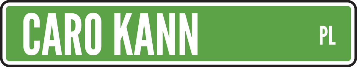 Green street sign reading Caro Kann Pl